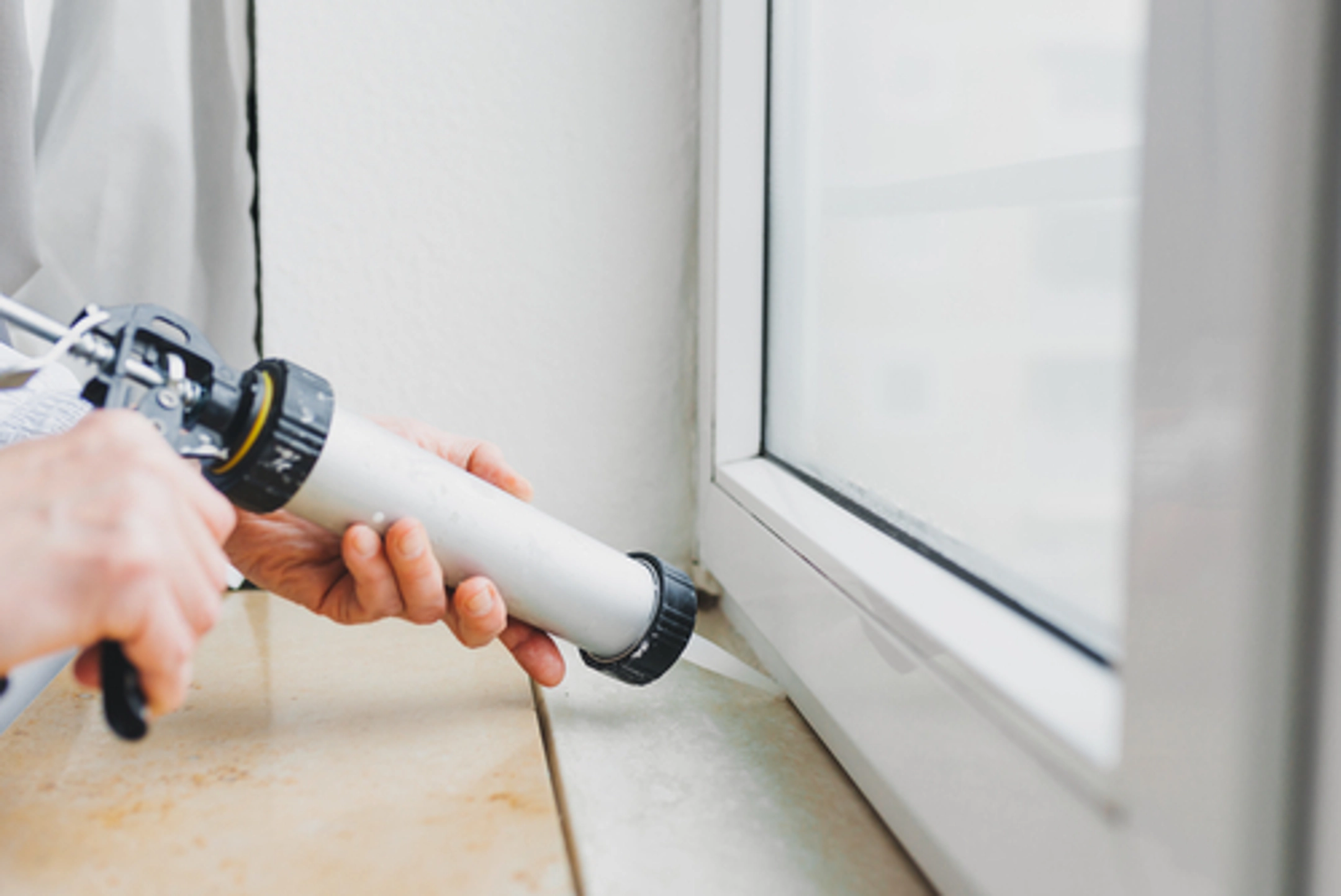 Caulk is one of many tools you can use to winterize your windows to prevent water damage to your home or business