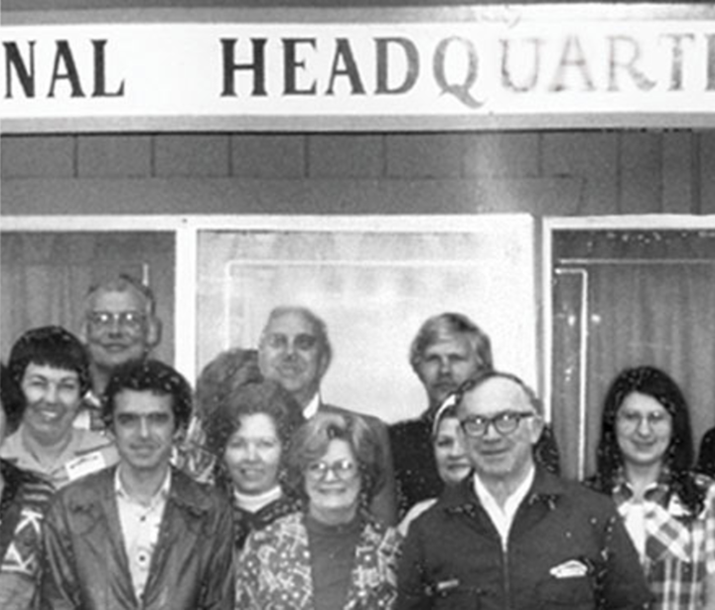 Group of people taking photo in old SERVPRO headquarters